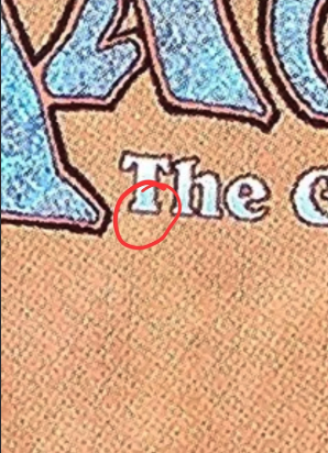 Extreme close-up of the capital T in "The Gathering" on the back of an MTG card, with a red circle marking the base of the T where the T-test looks for a sawtooth edge